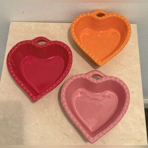 3 William Sonoma heart shaped ceramic dishes. 5” Red, pink and orange.